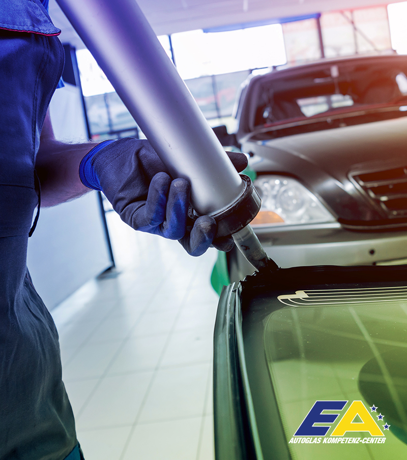 Happy woman driving a car and smiling